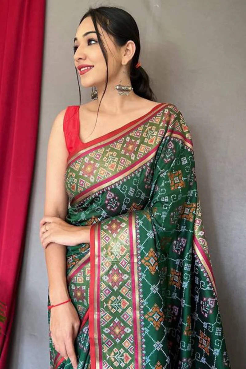 Jazzy Dark Green Patola Silk Saree with Cynosure Blouse Piece - Image 2