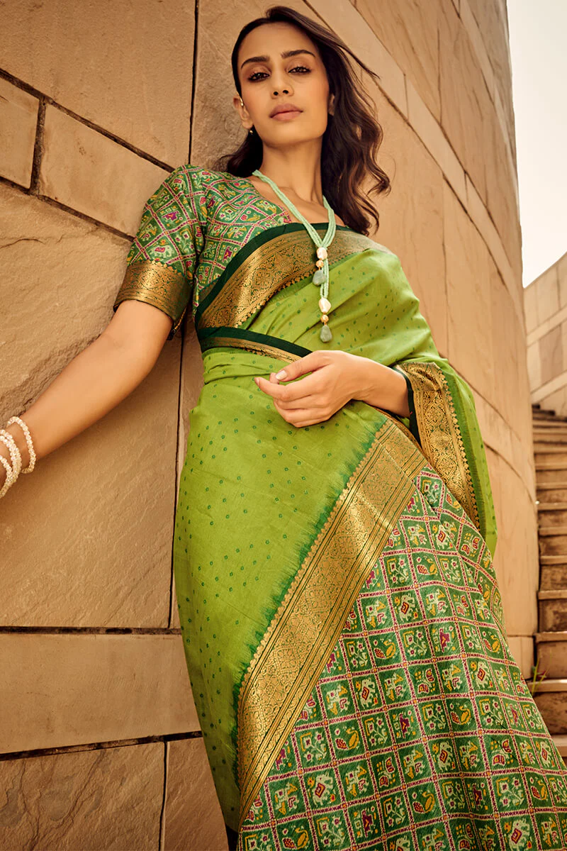 Ornate Green Patola Silk Saree with Tremendous Blouse Piece - Image 4